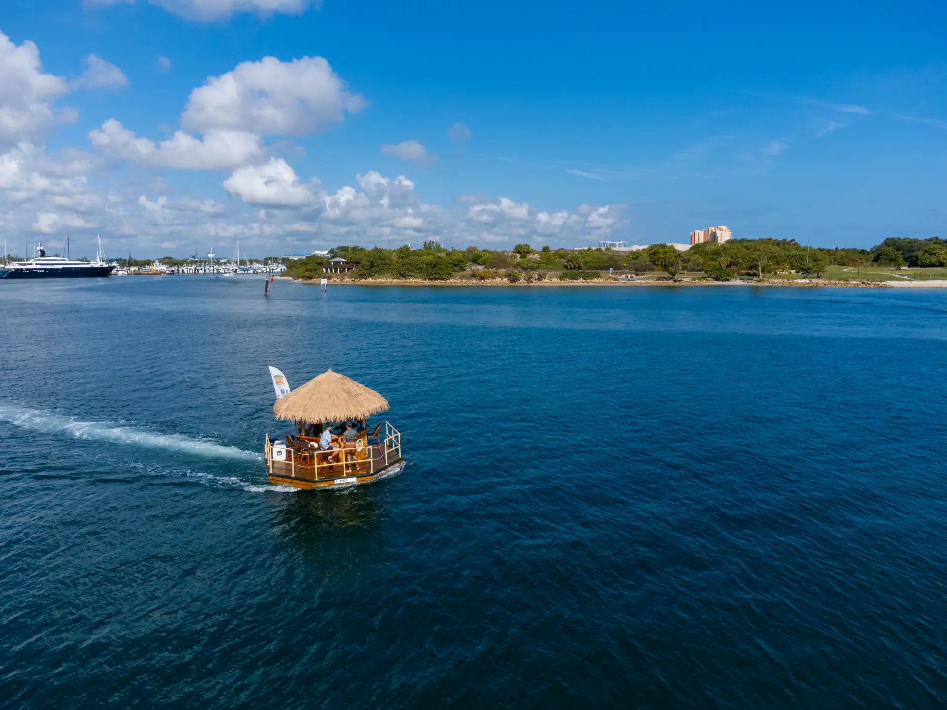 Aerial view of commercial tiki boat cruising on open water