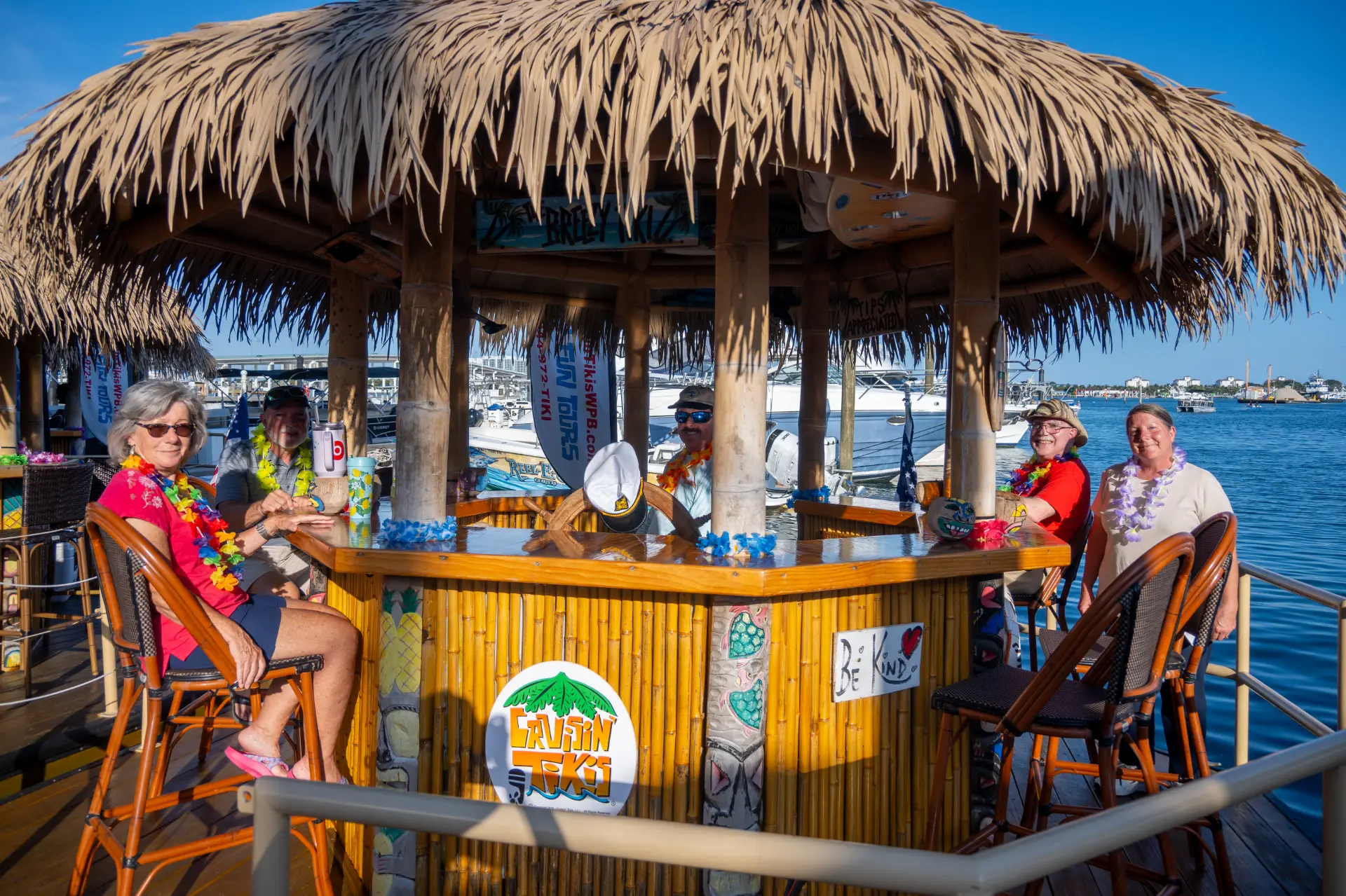 Tiki boat bar area with bamboo canopy and seating
